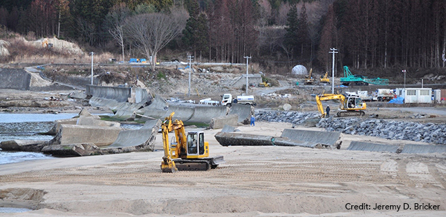 Post-tsunami cleanup of seawall remnants in Kirikiri, Otsuchi, Iwate Prefecture, December 2011